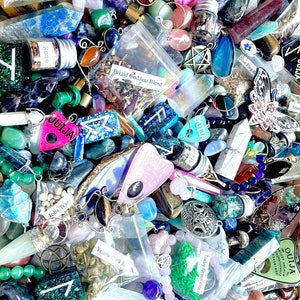 May include: A collection of various crystals, herbs, and other magical items in small bags and jars. The items are arranged in a chaotic and colorful display. Some of the items include a Ouija board, a pentagram, and a variety of crystals, such as amethyst, rose quartz, and clear quartz.