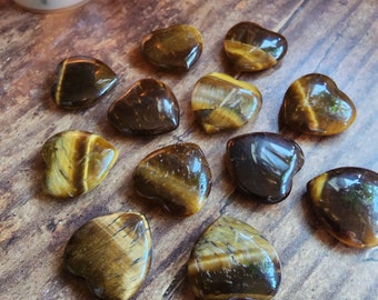 Tigers Eye. Free spell option for your mini heart crystal. Associated with: Luck, Protection, Prosperity, Strength, Kundalini awakening.