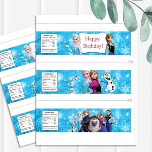 May include: Printable water bottle labels featuring characters from the animated film Frozen. The labels are white with a blue background and feature images of Elsa, Anna, Olaf, Kristoff, and Sven. The text "Happy Birthday!" is printed in red on the top label.
