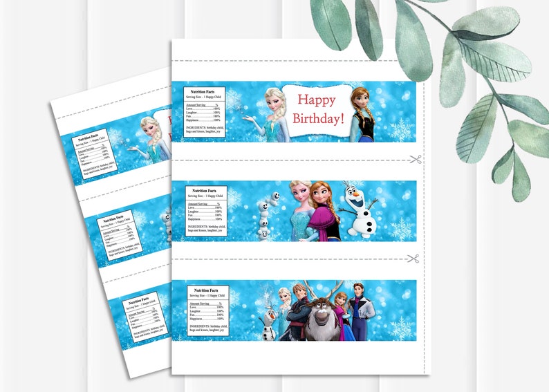 May include: Printable water bottle labels featuring characters from the animated film Frozen. The labels are white with a blue background and feature images of Elsa, Anna, Olaf, Kristoff, and Sven. The text "Happy Birthday!" is printed in red on the top label.