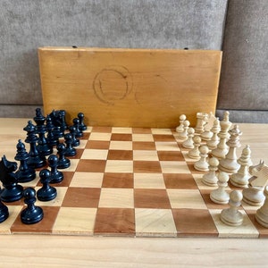 Vintage Germany chess set 80s in good condition with original box and board.  A great gift for collectors and chess lovers.