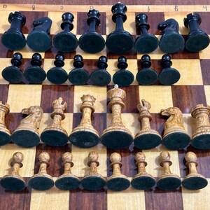 A rare chess set made from Karelian birch, prominent for being depicted in the most famous chess photograph of all time. image 10