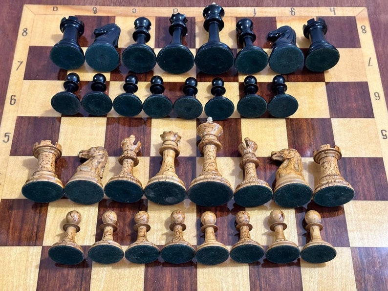 A rare chess set made from Karelian birch, prominent for being depicted in the most famous chess photograph of all time. image 10