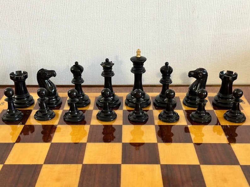 A rare chess set made from Karelian birch, prominent for being depicted in the most famous chess photograph of all time. image 7