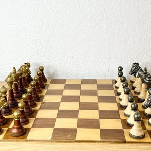 Vintage  chess set made of metal in original box in very good condition approximately 90s .