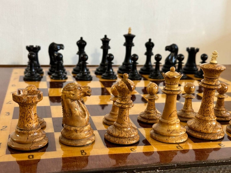 A rare chess set made from Karelian birch, prominent for being depicted in the most famous chess photograph of all time. image 3
