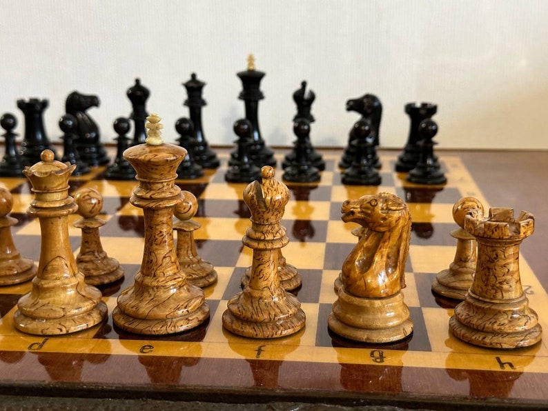 A rare chess set made from Karelian birch, prominent for being depicted in the most famous chess photograph of all time. image 4