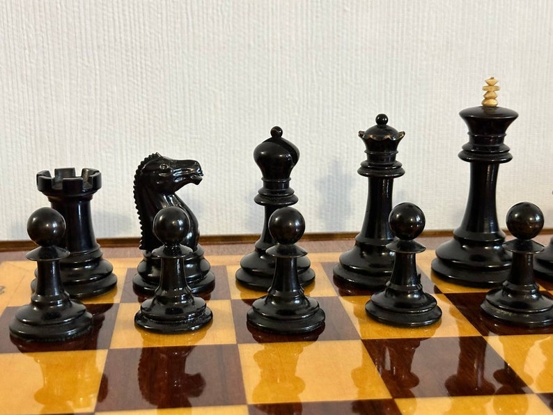 A rare chess set made from Karelian birch, prominent for being depicted in the most famous chess photograph of all time. image 5