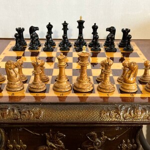 A rare chess set made from Karelian birch, prominent for being depicted in the most famous chess photograph of all time. image 1