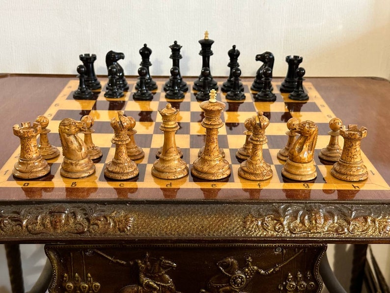 A rare chess set made from Karelian birch, prominent for being depicted in the most famous chess photograph of all time. image 1