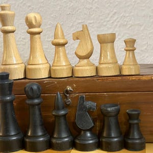 Germany chess set with heavy weights 60s vintage in great collectible condition.  A great gift for chess lovers and collectors.