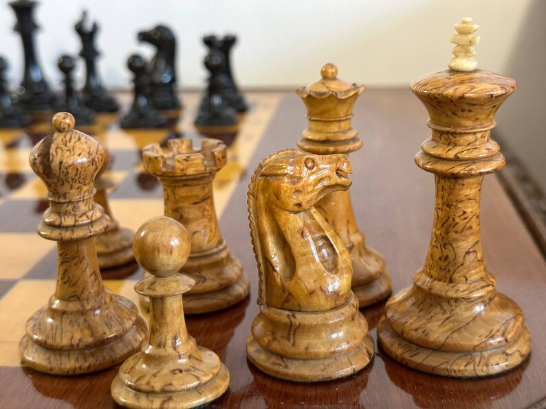 A rare chess set made from Karelian birch, prominent for being depicted in the most famous chess photograph of all time. image 8