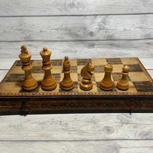 Germany wood chess set 80s vintage in good condition. Beautiful chess pieces. Great gift for mens, collectors and chess lovers!