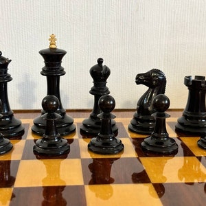 A rare chess set made from Karelian birch, prominent for being depicted in the most famous chess photograph of all time. image 6