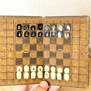 Vintage Germany pocket chess 30s vintage.  Chess pieces made of plastic. Very good vintage condition. Great gift for mens and collectors.