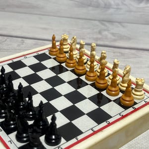 Germany magnetic pocket chess set in very good condition. Very rare chess pieces in original board and box.
