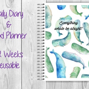 May include: A daily diary and food planner with a whale-themed cover. The cover features a white background with a repeating pattern of watercolor whales in shades of blue and green. The text "Everything whale be alright!" is written in black on a white rectangle.