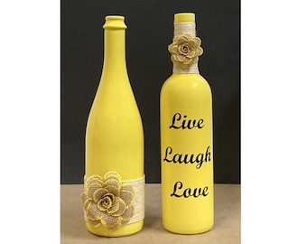 Wine Bottle Decorated Centerpiece with Live Laugh Love saying. Spray Painted Sun Yellow and beautifully decorated. Great Gift,