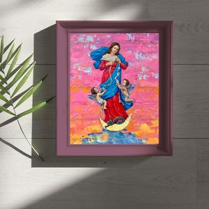 May include: A framed painting of a woman in a blue and red dress standing on a crescent moon with two angels. The background is a pink and orange abstract design.