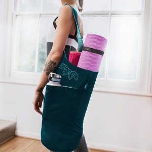 yoga bag filled with accessories carried over the shoulder