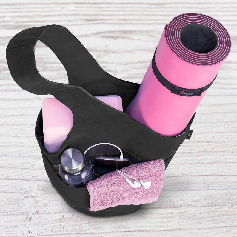 yoga bag filled with accessories and yoga mat