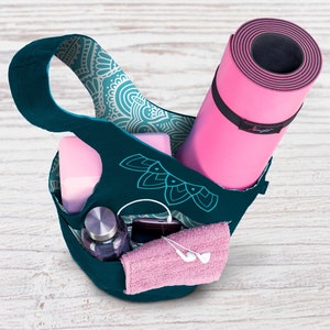 yoga bag filled with accessories and yoga mat