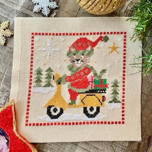 Santa Cat in a scooter- cross stitch chart by December Stitches