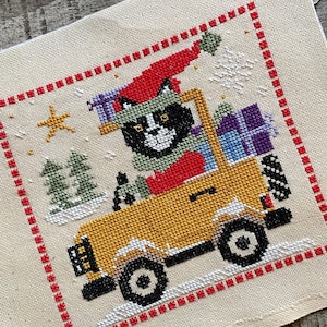 Santa Cat in a Jeep- cross stitch chart by December Stitches