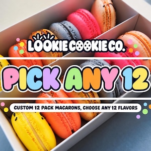 May include: A white box containing twelve colorful macarons in various shades of yellow, orange, pink, and grey. The text LOOKIE COOKIE CO. PICK ANY 12 CUSTOM 12 PACK MACARONS, CHOOSE ANY 12 FLAVORS is overlaid on the image in a bold font.