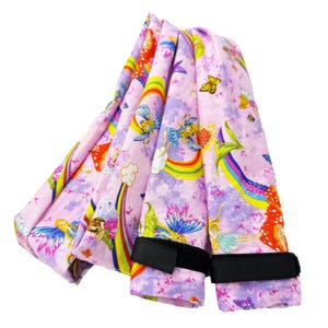 May include: A set of three ceramic mugs with a speckled, cream-colored glaze. Each mug features a different hand-painted floral design in shades of blue, green, and yellow. The mugs have a simple, modern shape with a comfortable handle.