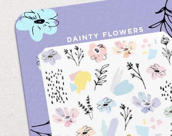 May include: A sheet of stickers with a variety of dainty flowers in pastel colors, including pink, blue, yellow, and purple. The sheet also includes abstract shapes and lines in black and white. The text "DAINTY FLOWERS" is printed at the top of the sheet.