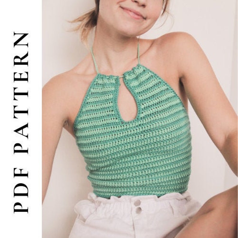 May include: A green crochet halter top with a keyhole opening in the front. The top is made with a striped pattern.