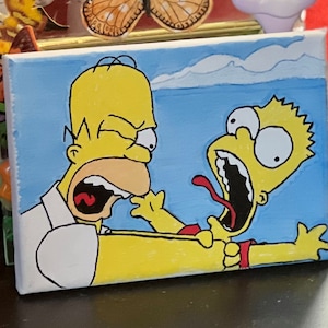 May include: A hand-painted canvas featuring a yellow cartoon character with a red tongue sticking out, screaming in fear as another yellow cartoon character with a white shirt and a yellow face, with a wide open mouth, grabs the screaming character's arm.