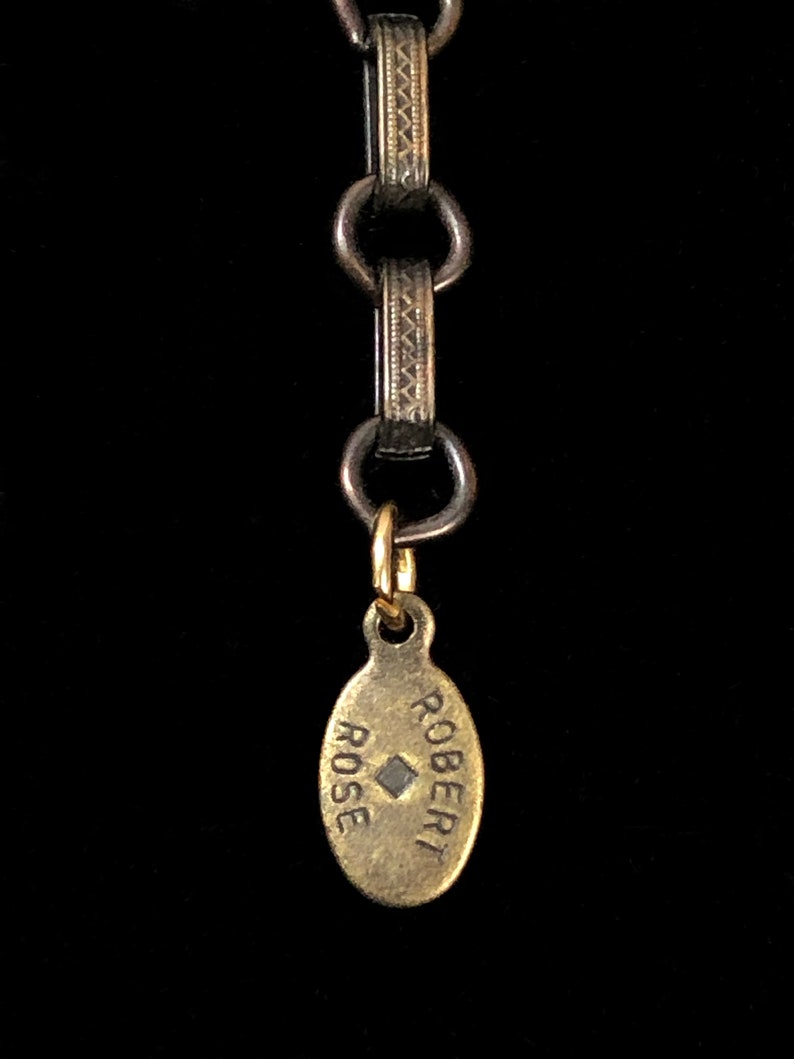 A Robert Rose necklace with matching bracelet.