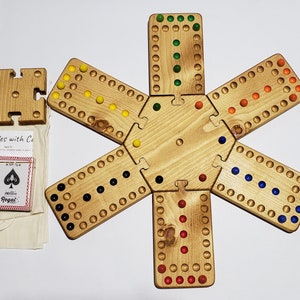 Marbles with cards board game 2-6 players 7 x 5 hole 19.5 inches across assembled wood with 16mm (5/8&quot;) glass marbles stained golden oak