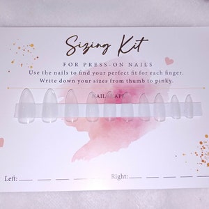 May include: A sizing kit for press-on nails. The kit includes ten clear plastic nails of different sizes. The card has a pink watercolor background with gold glitter and the text "Sizing Kit" and "FOR PRESS-ON NAILS". The text "Use the nails to find your perfect fit for each finger. Write down your sizes from thumb to pinky." is also on the card. There are two blank lines for "Left:" and "Right:" to write down the sizes.