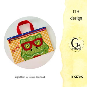 May include: A yellow and white checkered fabric bag with a red handle. The bag features an embroidered dinosaur with glasses and the word "ROAR". The bag is an in-the-hoop embroidery design.