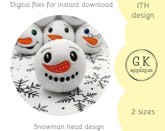 May include: A close-up of a white snowman head with a red nose and black eyes. The snowman head is surrounded by white snowflakes on a black background. The text "ITH design" and "GK applique" are visible in the image. The text "2 sizes" is also visible in the image. The text "Snowman head design" is visible at the bottom of the image.