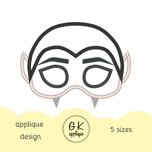 May include: Black and white line art embroidery design of a vampire mask with fangs. The design is available in five sizes.