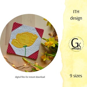 May include: A square, quilted fabric coaster with a yellow tulip design. The coaster has a white center with a red polka dot border. The text "ITH design" and "9 sizes" are visible. The logo for "Gk Applique" is also visible.