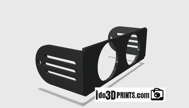 May include: Black plastic gauge mount with two circular cutouts for gauges. The mount has a curved back and a flat front with a series of slots on the side.
