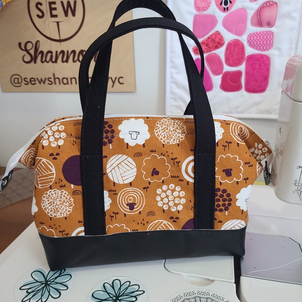 Small wire framed project bag. Perfect for shawl and sock projects.