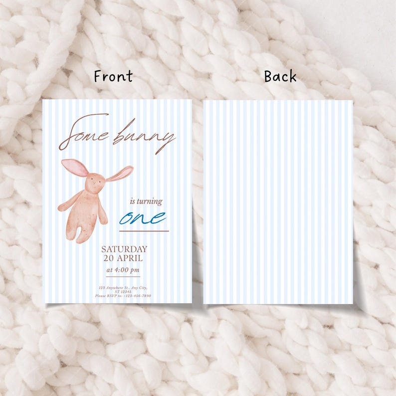 May include: A two-sided invitation with a light blue striped background. The front features the text "Some bunny is turning one" with a watercolor illustration of a bunny. The back has a matching striped pattern.