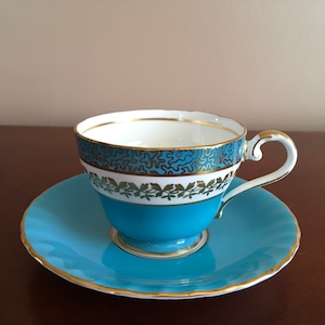 Vintage Turquoise and Gold Leaf pattern fine bone china tea cup with saucer