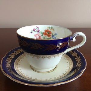 Vintage Aynsley Cobalt Blue with gold and Floral pattern fine bone cup with matching saucer