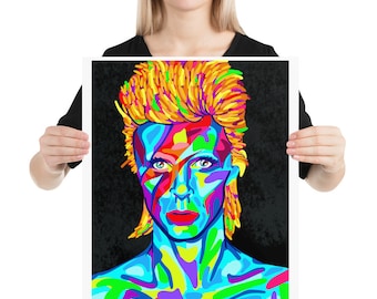 Puede incluir: Un retrato abstracto y colorido de David Bowie con un peinado de color naranja y amarillo brillante. El retrato está compuesto por varios tonos de azul, verde, rojo, amarillo y rosa.