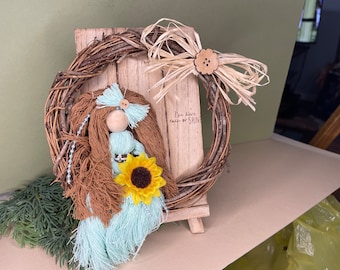 Teal and Brown Floss Doll Sitting in Grapevine Wreath on a Stand Up Shelf Sitter