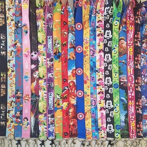 May include: A collection of 20 colorful lanyards with various Disney character designs, including Mickey Mouse, Minnie Mouse, Frozen, Star Wars, and more. Each lanyard features a different character and has a black metal swivel hook.