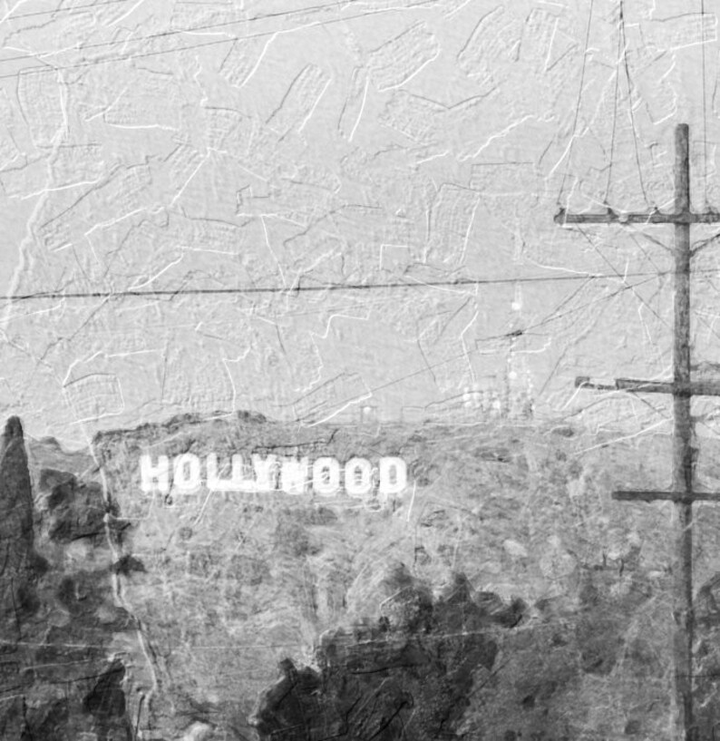 May include: A black and white photo of the Hollywood sign with a power line in the foreground.