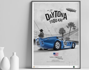 May include: A black and white poster featuring a blue Ford GT40 race car with the number 13 on the side. The car is on a race track with palm trees in the background. The text "DAYTONA 2000 KM" is at the top of the poster.